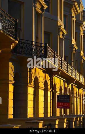 Terraced houses in the late afternoon sun in the coastal town of Brighton UK Stock Photo