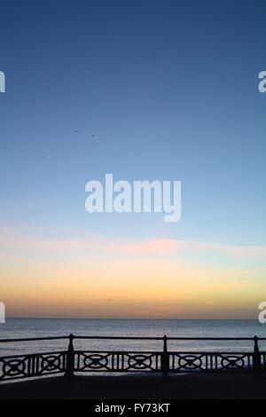 Sunset over Brighton beach UK Stock Photo