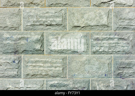 Big granite stone blocks on a solid wall. Stock Photo