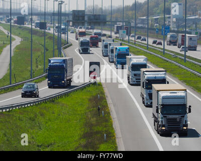 Lots of trucks traffic on the E19 near the Belgian-Dutch border at Hazeldonk (looking towards Belgium) Stock Photo