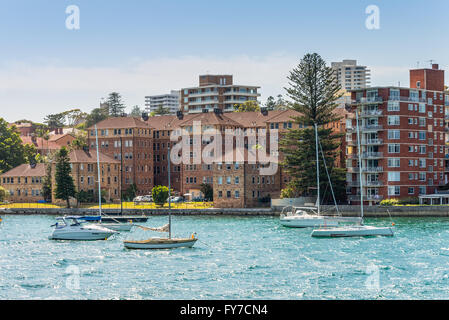 Sailboats moored in the Manly district bay on Summer day, near Sydney, Australia