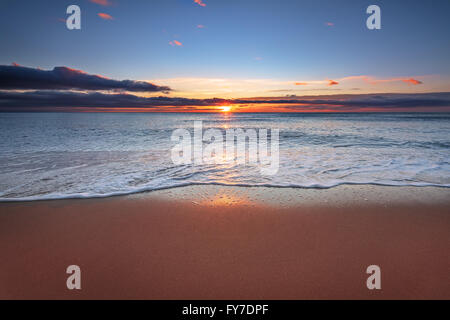 Sunrise light shining on ocean waves. Stock Photo