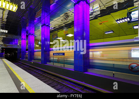 Blurred train in the Munchner Freiheit subway station, Munich Stock Photo