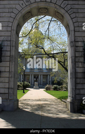 State capitol of the State of New Hampshire, USA seen through arched granite entry arch. Stock Photo