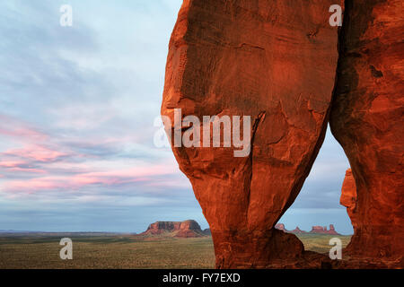 Sunset glow on Teardrop Arch in Utah’s Monument Valley Tribal Park. Stock Photo