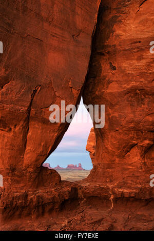 Sunset glow on Teardrop Arch in Utah’s Monument Valley Tribal Park. Stock Photo