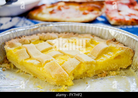 home made cream lemon tart in aluminum pan Stock Photo