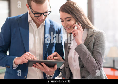 Nice colleagues using tablet Stock Photo