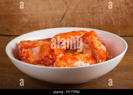 Chicken wings in the marinade sauce Stock Photo