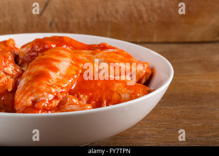 Chicken wings in the marinade sauce Stock Photo