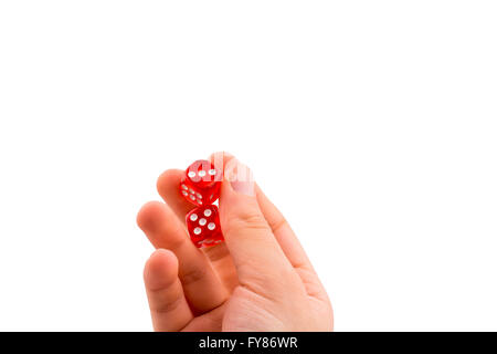 Hand holding red dice on a white background Stock Photo