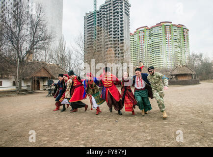 Soldiers of Georgia National Legion (part of Armed Forces of Ukraine) take part in traditional games during Maslenitsa festivities in Mamayeva Sloboda, Kyiv, Ukraine (Photo by Oleksandr Rupeta) Stock Photo