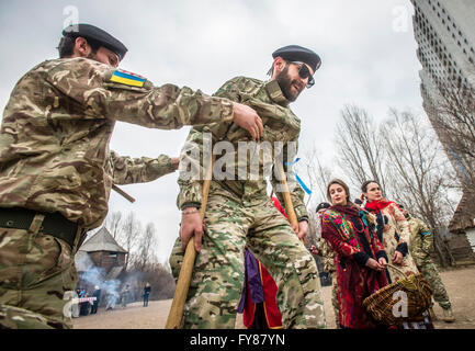 Soldiers of Georgia National Legion (part of Armed Forces of Ukraine) take part in traditional games during Maslenitsa festivities in Mamayeva Sloboda, Kyiv, Ukraine (Photo by Oleksandr Rupeta) Stock Photo