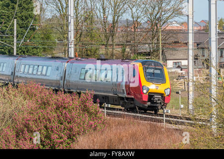 A Virgin Voyager diesel passenger train passing Winwick junction on the West Coast Main Line. WCML. Cheshire North West England. Stock Photo