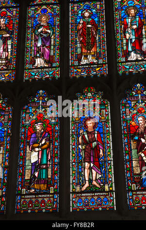 UK, Kent, Tenterden, High Street, St Mildred’s church interior, East Window detail of colourful stained glass Stock Photo