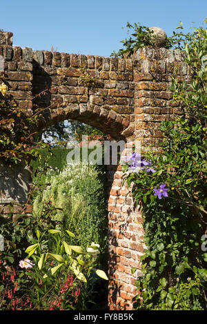 UK, Kent, Sissinghurst Castle, brick arch leading to walled White Garden Stock Photo