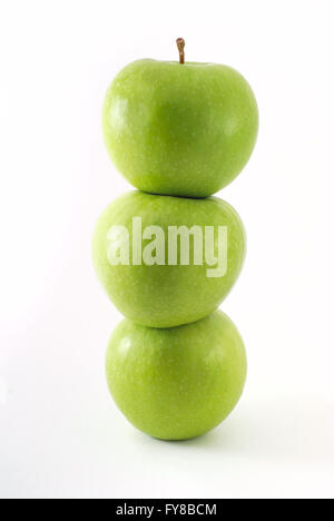Fresh green apples stacked on top of one another Stock Photo