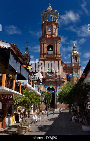 Our Lady of Guadalupe church in Puerto Vallarta Mexico with street and shops Stock Photo