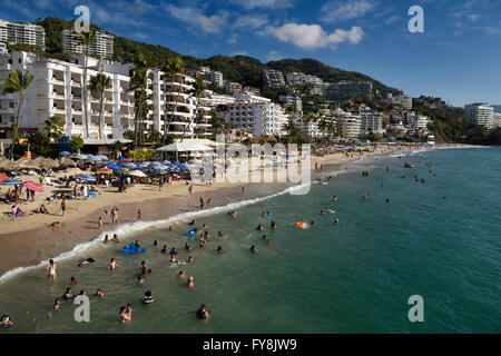 Locals and tourists swimming in the Pacific ocean at Los Muertos beach Puerto Vallarta Mexico Stock Photo