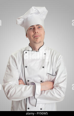 young cook man standing on a white background Stock Photo