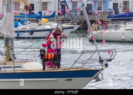 Weymouth, England. 23 April 2016, Woman, child and dog on sailing boat. Credit:  Frances Underwood/Alamy Live News Stock Photo