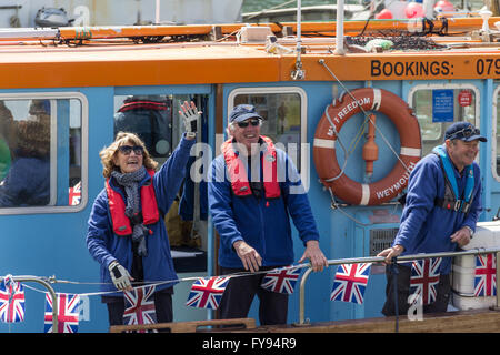 Weymouth, England. 23 April 2016. Queen's 90th Birthday Floating Tribute. People waving from disabled boat, MV Freedom. Credit:  Frances Underwood/Alamy Live News Stock Photo