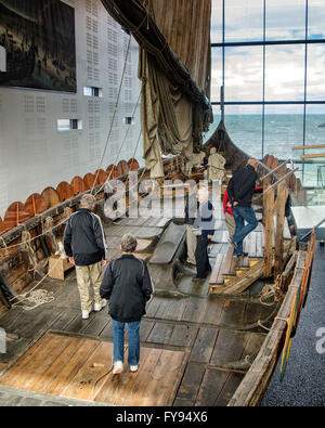 Reykjanesbaer, Southern Peninsula, Iceland. 5th Aug, 2015. Tourists walk aboard the Ãslendingur (Icelandic: ''Icelander''), a replica of an authentic 9th century Viking ship found in a Norwegian burial mound, on display in the seaside Viking World Museum in Reykjanesbaer on the Southern Peninsula in Iceland, a favorite tourist destination. Tourism has become a growing sector of the economy. © Arnold Drapkin/ZUMA Wire/Alamy Live News Stock Photo