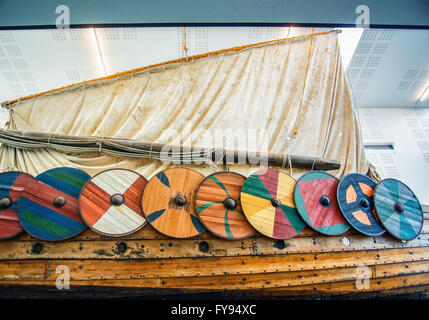 Reykjanesbaer, Southern Peninsula, Iceland. 5th Aug, 2015. Shields line the side of the Ãslendingur (Icelandic: ''Icelander''), a replica of an authentic 9th century Viking ship found in a Norwegian burial mound, on display in the seaside Viking World Museum in Reykjanesbaer on the Southern Peninsula in Iceland, a favorite tourist destination. Tourism has become a growing sector of the economy. © Arnold Drapkin/ZUMA Wire/Alamy Live News Stock Photo