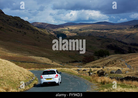 Car on Honister Pass (B5289), Lake District National Park, Cumbria, England UK Stock Photo