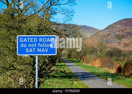 Sign: Gated road, do not follow satnav, Cumbria, England UK Stock Photo ...