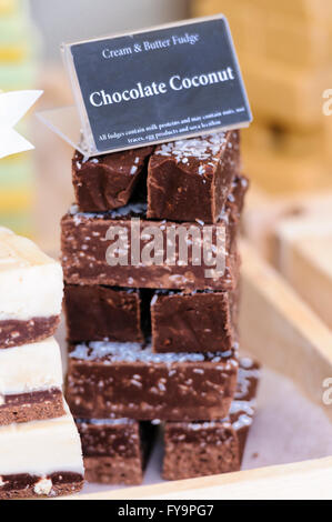 Chocolate coconut cream and butter fudge on sale at a market stall Stock Photo