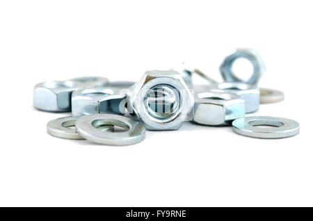 Several metal screw washers and nuts isolated on white background. Stock Photo