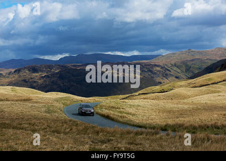 Car on Honister Pass (B5289), Lake District National Park, Cumbria, England UK Stock Photo