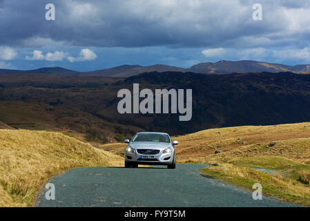 Car on Honister Pass (B5289), Lake District National Park, Cumbria, England UK Stock Photo