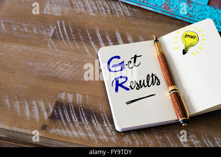 Conceptual Business Acronym GR Get Results. Retro effect and toned image of a fountain pen on a notebook Stock Photo