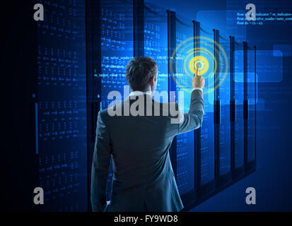 Business man using circle interface in data center Stock Photo