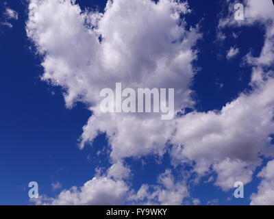 Heart shaped white cloud against blue skies abstract background Stock Photo