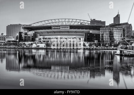 Melbourne, Australia - Feb 21 2016: Etihad Stadium viewed from Docklands waterfront in early morning light. Black and white imag Stock Photo