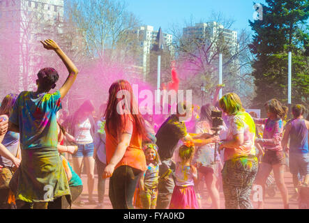 London Ontario, Canada - April 16: Unidentified young colorful people having fun and celebrating at the Festival of Colours Stock Photo