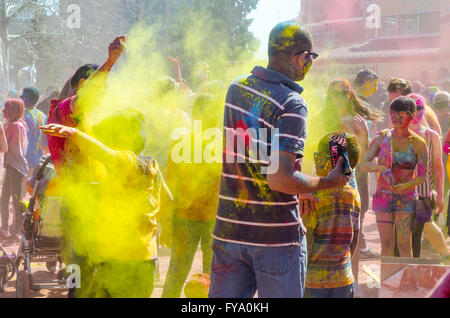 London Ontario, Canada - April 16: Unidentified young colorful people having fun and celebrating at the Festival of Colours Stock Photo