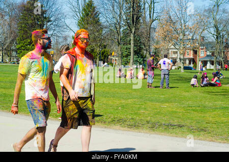 Two unidentified young colorful boys walking in the park and celebrating the Festival of Colors (Holi Festival) Stock Photo