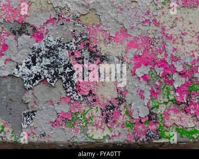 old,  crumbling wall with multi-colored paint splashes Stock Photo