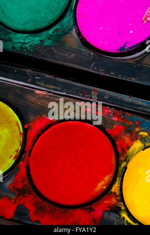 Color paints in a black plastic box Stock Photo