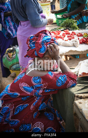 African woman looking at the lens, Tanjih fish market, the biggest African fish market, Gambia, Africa Stock Photo