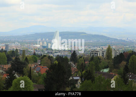 A photograph of the new Roche Tower (Building 1, or Bau 1) in Basel, Switzerland, taken from atop a water tower in Bruderholz. Stock Photo