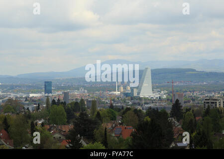 A photograph of the new Roche Tower (Building 1, or Bau 1) in Basel, Switzerland, taken from atop a water tower in Bruderholz. Stock Photo