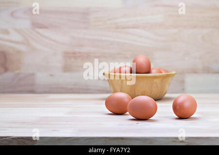 hen's eggs in wooden bowl Stock Photo
