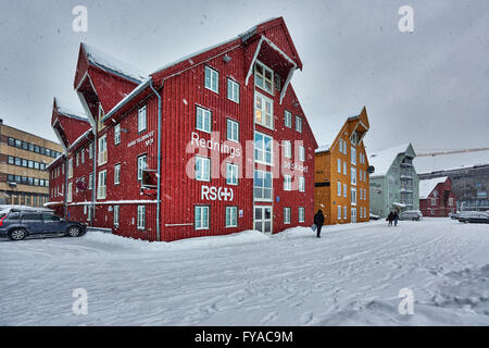 typical colorful wooden buildings in harbour of Tromsø, winter with much snow, Troms, Norway, Europe Stock Photo