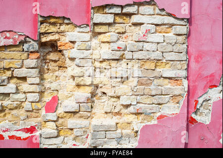 Vintage tone Cracked Old Brick wall for background Stock Photo