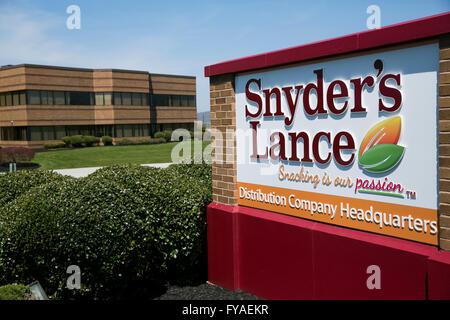A logo sign outside of the distribution headquarters of Snyder's-Lance, Inc., in Hanover, Pennsylvania on April 17, 2016. Stock Photo